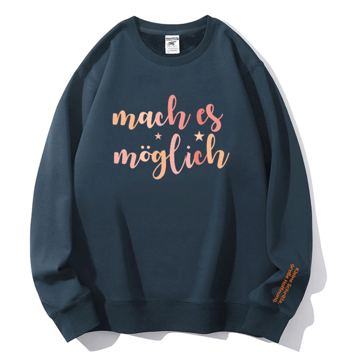 "mach es möglich" Rundhals-Sweatshirt – Kleine Schritte, große Hoffnung.
