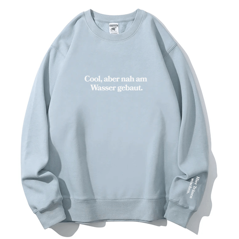"Cool, aber nah am Wasser gebaut." Rundhals-Sweatshirt