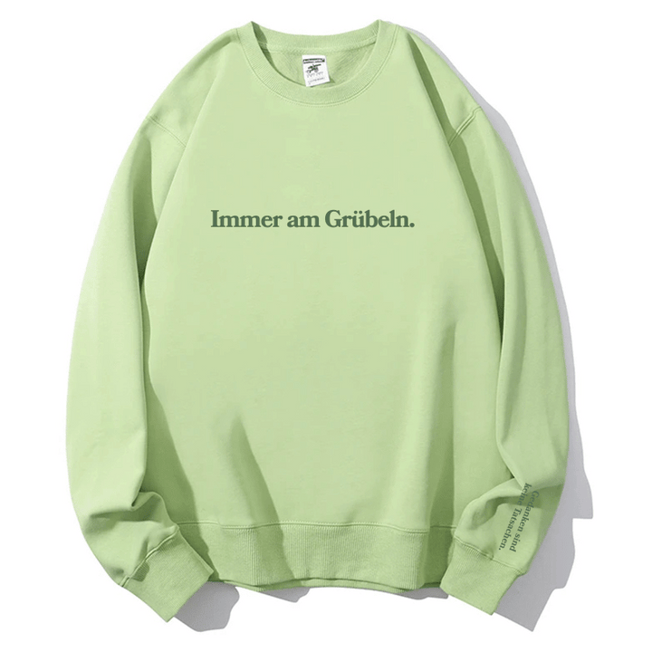 "Immer am Grübeln." Rundhals-Sweatshirt – Gedanken sind keine Tatsachen.