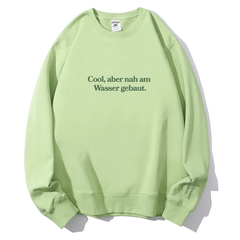 "Cool, aber nah am Wasser gebaut." Rundhals-Sweatshirt